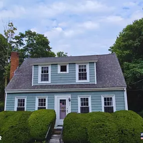 completed roof of a light blue house