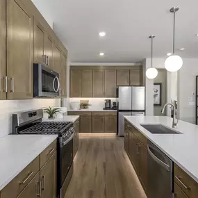 Kitchen with island in modern floor plans at Salem Foothills new construction homes in Salem, UT