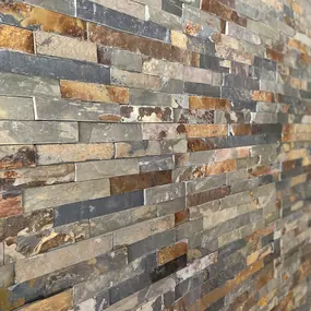 Enhance your home with the natural beauty of this stunning stone accent wall by Ledezma Remodeling. Perfect for a bathroom remodel or home renovation, this textured design adds warmth, character, and a timeless appeal to any space.