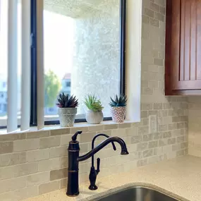 Here’s a close-up of a finished kitchen project by Ledezma Remodeling featuring beautifully installed backsplash and modern fixtures. In addition to bathroom remodeling, we also offer expert kitchen remodeling services.