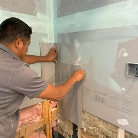 Here’s a behind-the-scenes look at Ledezma Remodeling in action, expertly installing tiles for a bathroom renovation. Our team ensures precision and quality in every step of the process.