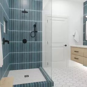 Bright, bold, and modern this stunning bathroom remodel design by Ledezma Remodeling brings a fresh take on home renovation! Featuring striking blue vertical tiles, sleek black fixtures, and a spacious glass-enclosed shower, this shower remodeling concept is both stylish and functional. The floating wood vanity and hexagon floor tiles add warmth and texture, creating a perfect balance of contemporary and timeless design. Let Ledezma Remodeling bring your dream bathroom to life!