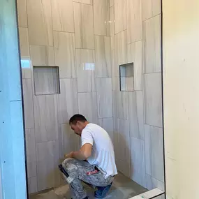What sets a great bathroom remodeling contractor apart? It's the focus on details like these perfectly aligned tiles and built-in niches crafted by Ledezma Remodeling. We treat every bathroom renovation like it's our own, because your space deserves nothing less.