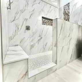 Ledezma Remodeling brought this space to life with a bold blend of sophistication and style. The rich mosaic inlays, marble-look walls, and spacious walk-in layout make this bathroom remodeling project feel like a personal retreat. It's the kind of space that turns everyday routines into moments of pure relaxation.