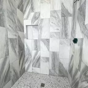 Sleek, sophisticated, and effortlessly stylis. This shower renovation by Ledezma Remodeling turns ordinary into extraordinary. From the dynamic wall tile to the clean, modern floor, it’s a space you’ll actually look forward to stepping into every day.