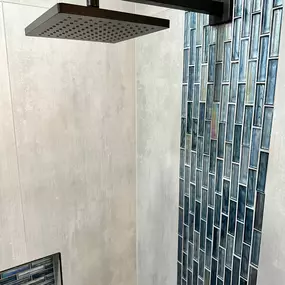 Ledezma Remodeling brought character and style to this space with a bold, modern take on shower remodeling. The rich blue tile accent and matte black rain showerhead create a striking visual contrast against the clean, textured walls. It’s a refreshing update that turns every shower into a moment of everyday luxury.
