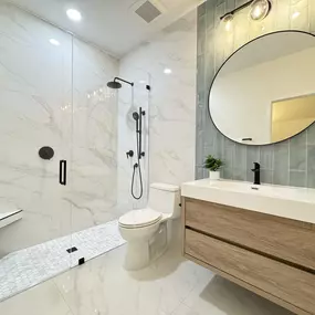As your trusted bathroom remodeling partner, we crafted this space to blend sleek modern design with cozy comfort. With custom tile accents, a floating vanity, and striking black fixtures, every element reflects thoughtful intention. At Ledezma Remodeling, we’re dedicated to making your bathroom a daily retreat you’ll love.