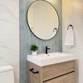 Ledezma Remodeling brings a clean, modern touch to this guest bathroom with warm wood tones, soft lighting, and soothing tile accents. As a trusted bathroom remodeling contractor, the team crafts spaces that feel both welcoming and well-designed. It’s a space you’ll want to show off and enjoy every day.