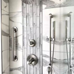 This elegant shower renovation by Ledezma Remodeling showcases the perfect balance of function and style. With its layered textures, brushed fixtures, and clean lines, the space feels thoughtfully designed and built for everyday ease. It’s a beautiful upgrade that adds both comfort and character to the home.