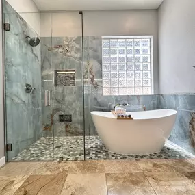 Ledezma Remodeling takes bathroom renovation to a whole new level of elegance. The seamless glass shower, freestanding tub, and rich aqua‑veined tiles create a breathtaking space that blends luxury with everyday comfort. It’s the kind of transformation that turns your bathroom into the highlight of your home.