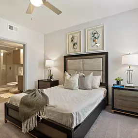 Bedroom with carpet and ensuite at Camden Leander apartments in Leander, Tx