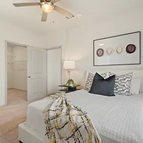 Bedroom with carpet, ensuite and walk-in closet at Camden Leander apartments in Leander, Tx