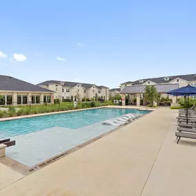 Pool and sundeck with tanning ledge at Camden Leander apartments in Leander, Tx