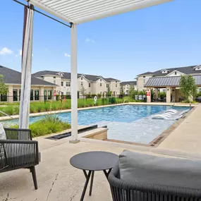 Poolside cabanas looking out toward pool at Camden Leander apartments in Leander, Tx