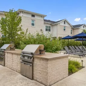 Poolside grills at Camden Leander apartments in Leander, Tx