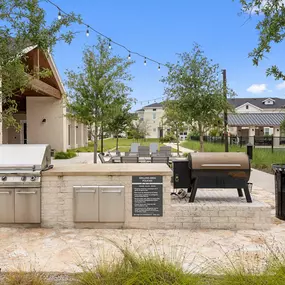 Grilling station with Traeger smoker at Camden Leander apartments in Leander, Tx