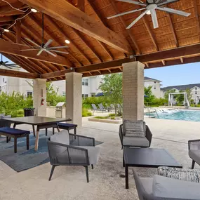 Poolside pavilion lounge with seating at Camden Leander apartments in Leander, Tx