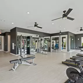 24-hour fitness center with free weights and cardio machines at Camden Leander apartments in Leander, Tx