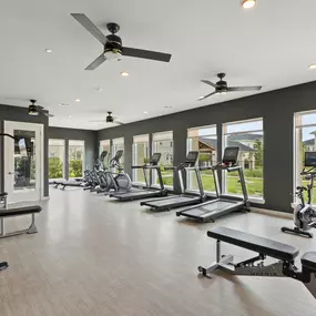 24-hour fitness center looking out at community at Camden Leander apartments in Leander, Tx