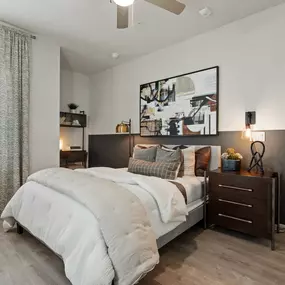 First-floor bedroom with wood-style flooring at Camden Leander apartments in Leander, Tx