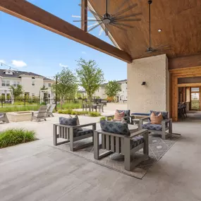 Outdoor covered patio lounge at Camden Leander apartments in Leander, Tx