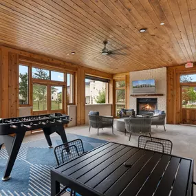 Screened-in porch with fireplace at Camden Leander apartments in Leander, Tx