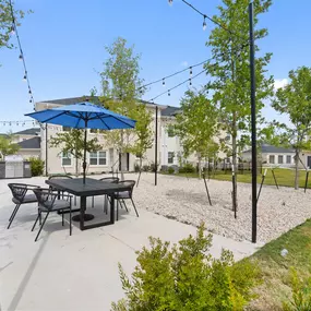 Courtyard lounge with grilling area at Camden Leander apartments in Leander, Tx