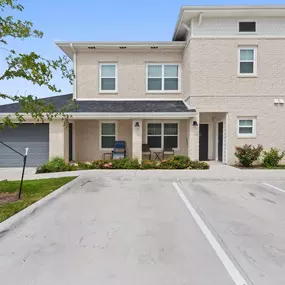 Front apartment home entry with parking in front at Camden Leander apartments in Leander, Tx