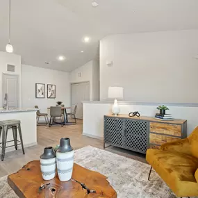 Second-floor living and dining room with half-wall on the private staircase at Camden Leander apartments in Leander, Tx