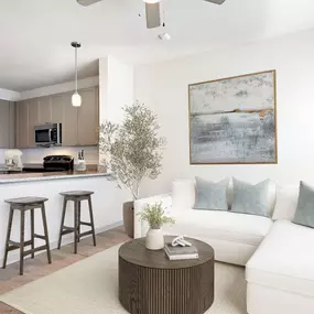Living room and kitchen with wood-style floors at Camden Leander apartments in Leander, Tx