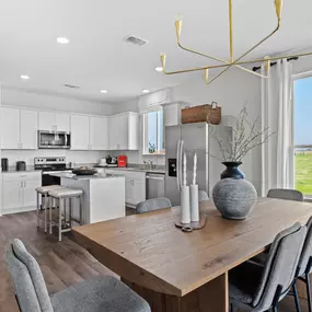 Open-concept kitchen in Dinero floor plan in Meadows at Clear Springs new homes in New Braunfels, TX