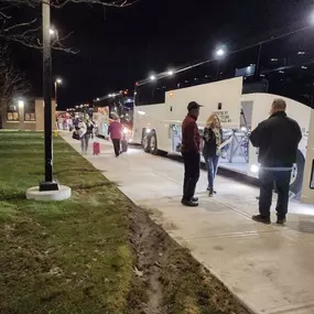 Passengers Loading Luggage onto Motorcoach