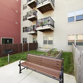 a bench in front of North Harrison Senior apartment building