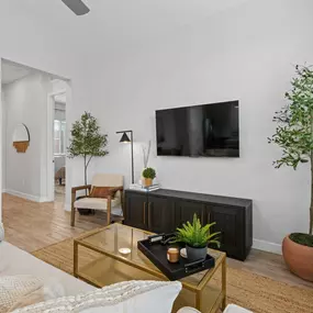 a living room with a couch and a tv