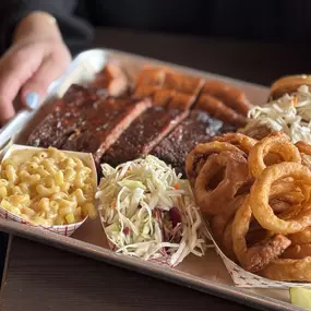 BBQ tray with onion rings, mac & cheese, slaw and Jalapeno Cheddar sausage.