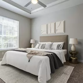 A cozy bedroom at Gramercy Park Apartments in Houston with a stylish and comfortable design.