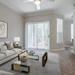 A stylish living room at Gramercy Park Apartments in Houston with modern furnishings and a cozy atmosphere.