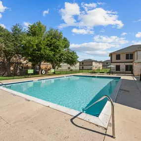 A refreshing swimming pool at Huntington Meadows Apartments in Austin with a relaxed outdoor setting.