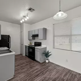 A practical kitchen area at Huntington Meadows Apartments in Austin with functional appliances.