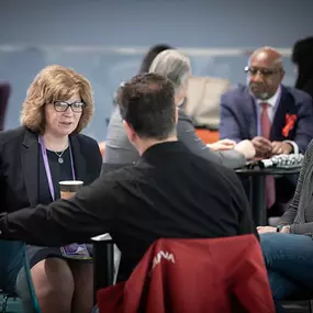 Attendees of RSA Conference CISO Forum Networking and Discussing over coffee