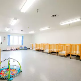 Community day room with baby cribs