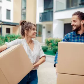 a couple with renters insurance moving into a new apartment