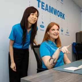 This moment says it all — collaboration, creativity, and just the right amount of fun. Whether they’re reviewing campaign content or brainstorming fresh ideas, our team thrives on real-time feedback and open communication. With “TEAMWORK” on the wall and in every part of our process, this shot captures how we turn big goals into bold results — together.