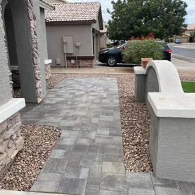 Enhance curb appeal with a custom paver driveway and walkway designed for durability and aesthetics. Our expert installation ensures a polished, long-lasting finish that complements your home’s exterior.