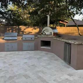 Enjoy outdoor living at its finest with a custom-built paver patio, complete with a fire pit and seating area. Designed for durability, beauty, and functionality, this space is ideal for entertaining guests and relaxing outdoors.