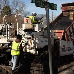 magnum paving employees and a dump truck