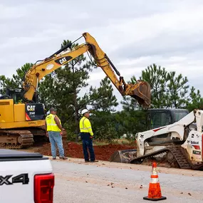 excavator on the side of the road