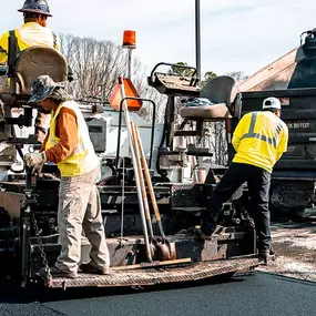 three magnum paving employees working at a jobsite