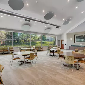 A conference room with a long table and chairs
