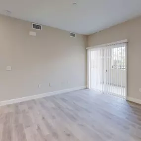 Room with vinyl plank & carpet flooring